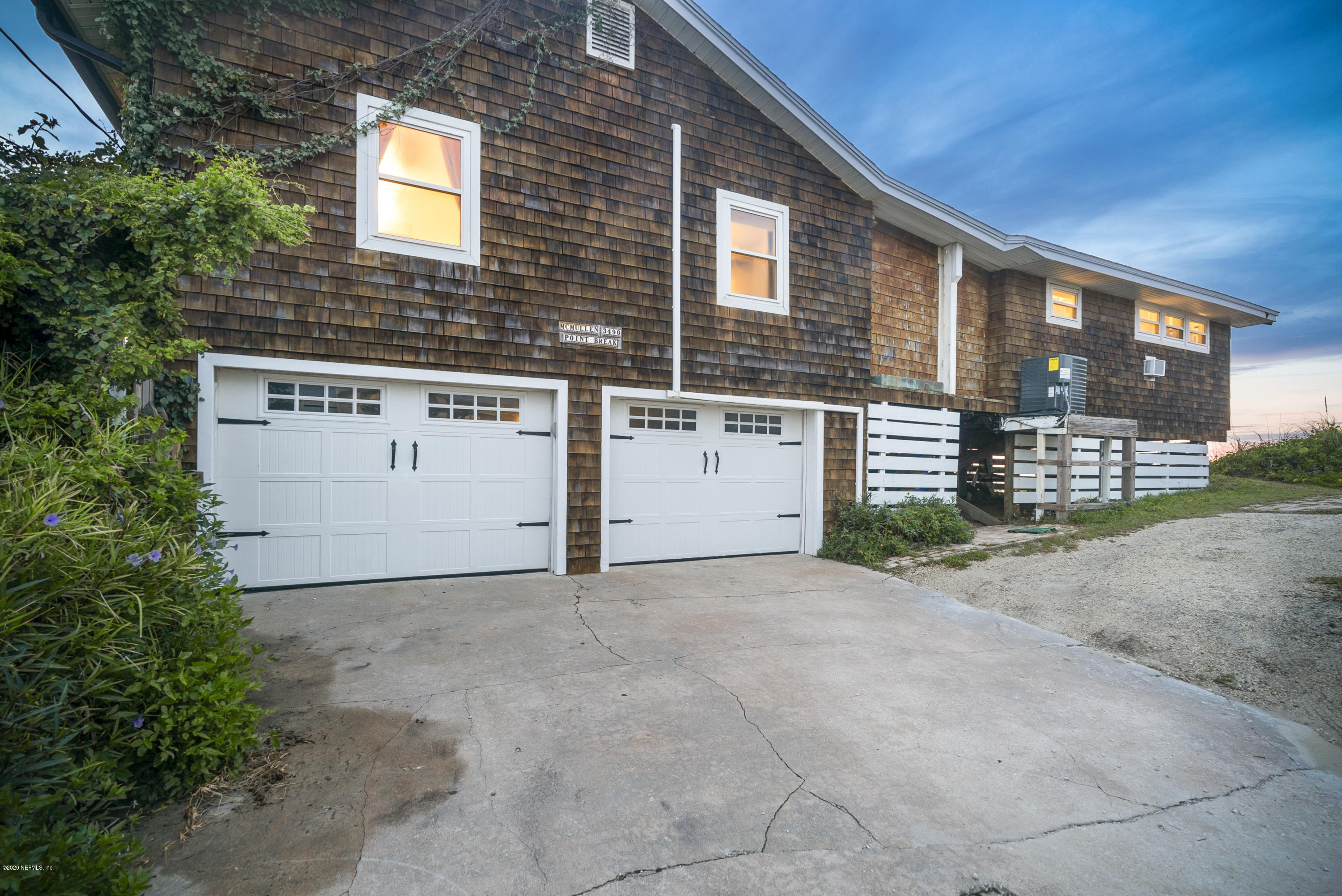 3490 Coastal Highway St. Augustine, FL 32084 - Photo 27 of 72 a view of a house with a yard and garage