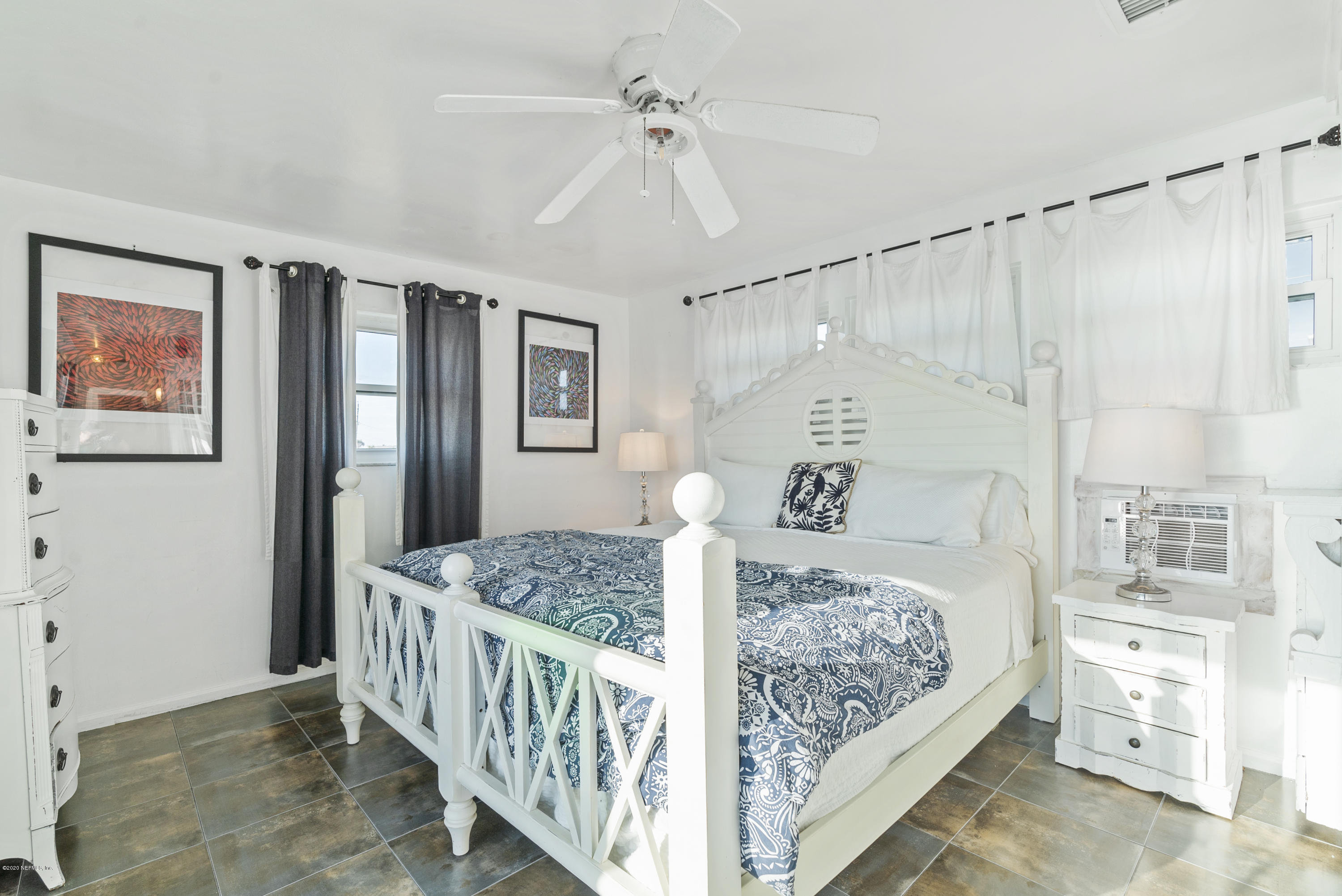 3490 Coastal Highway St. Augustine, FL 32084 - Photo 39 of 72 a bedroom with a bed and a window