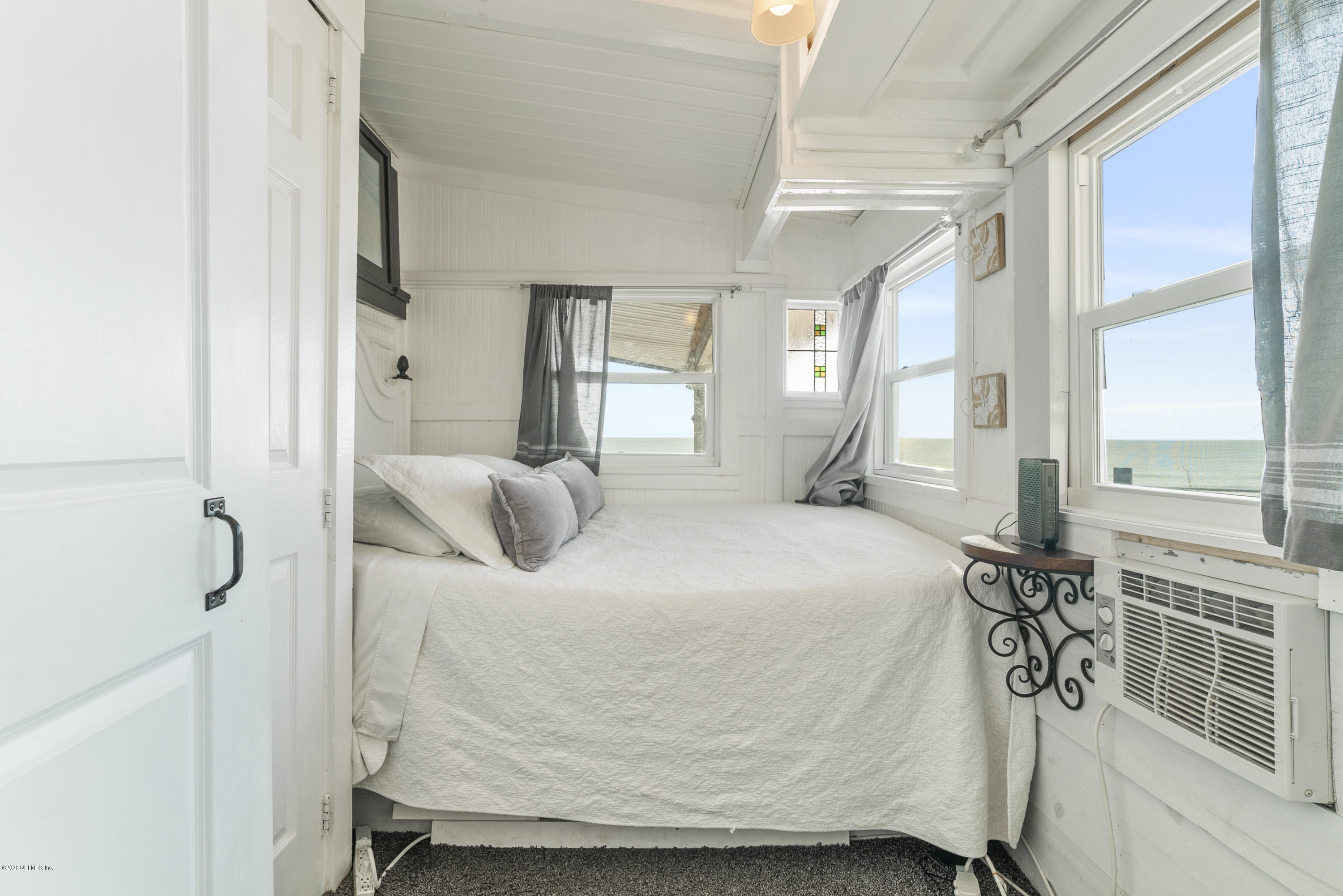 3490 Coastal Highway St. Augustine, FL 32084 - Photo 44 of 72 a bedroom with a bed and window