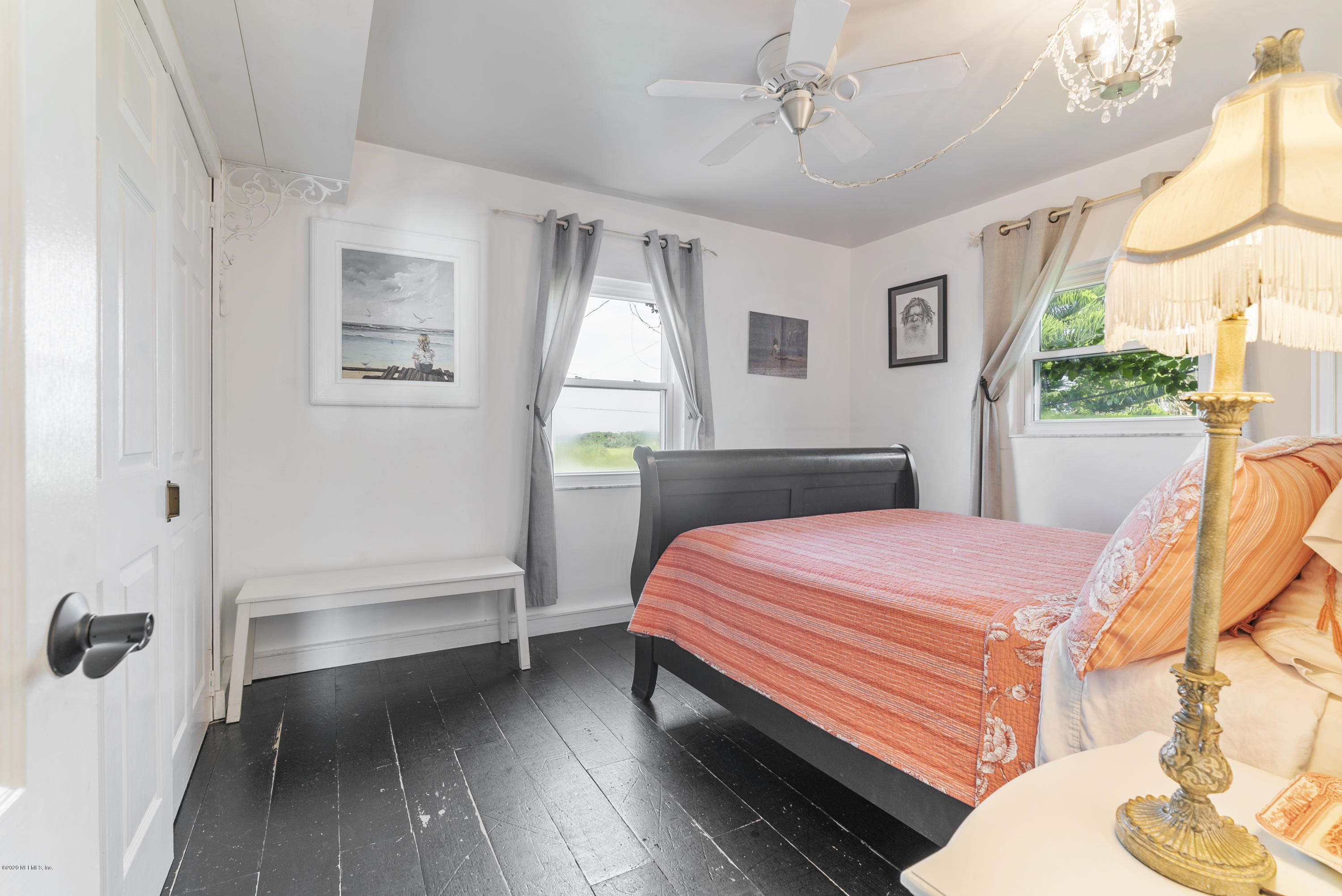 3490 Coastal Highway St. Augustine, FL 32084 - Photo 46 of 72 a bedroom with a bed and a large window with the outer view