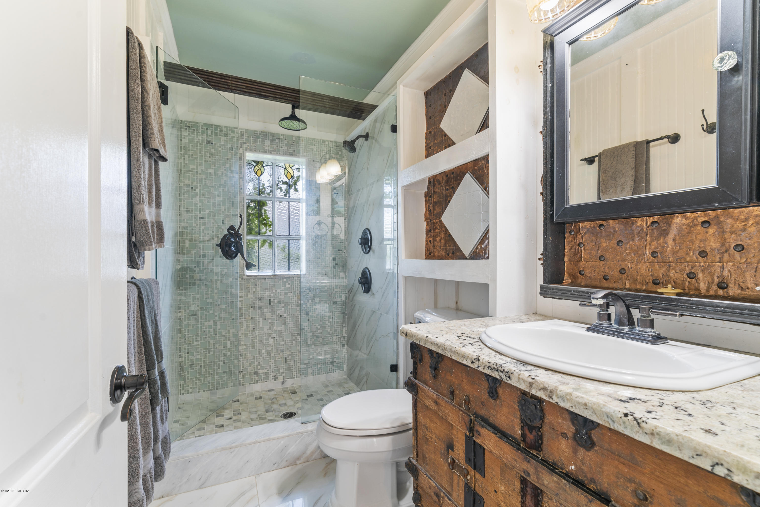 3490 Coastal Highway St. Augustine, FL 32084 - Photo 48 of 72 a bathroom with a sink toilet and shower