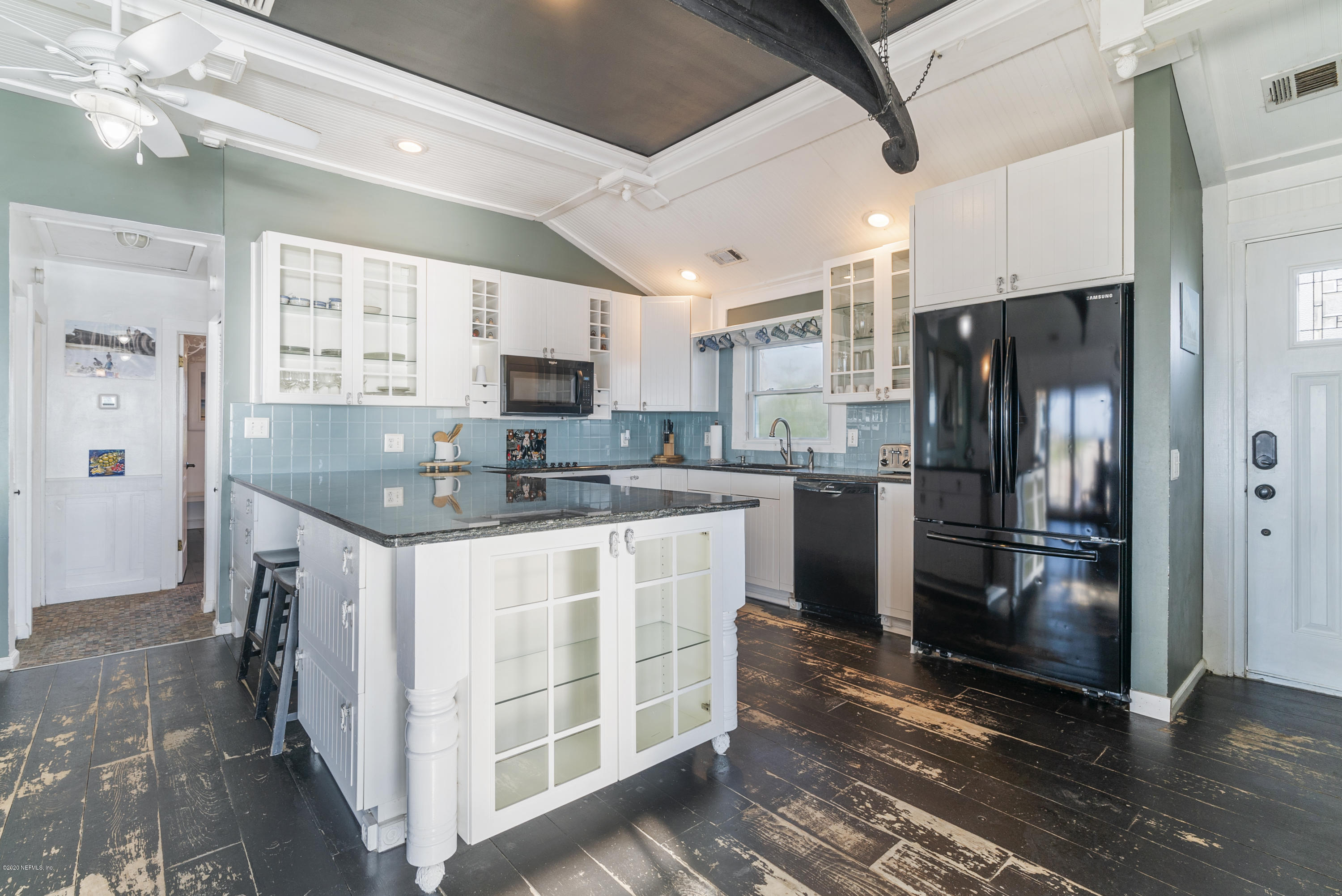 3490 Coastal Highway St. Augustine, FL 32084 - Photo 51 of 72 a kitchen with stainless steel appliances granite countertop a refrigerator a stove a sink and a refrigerator