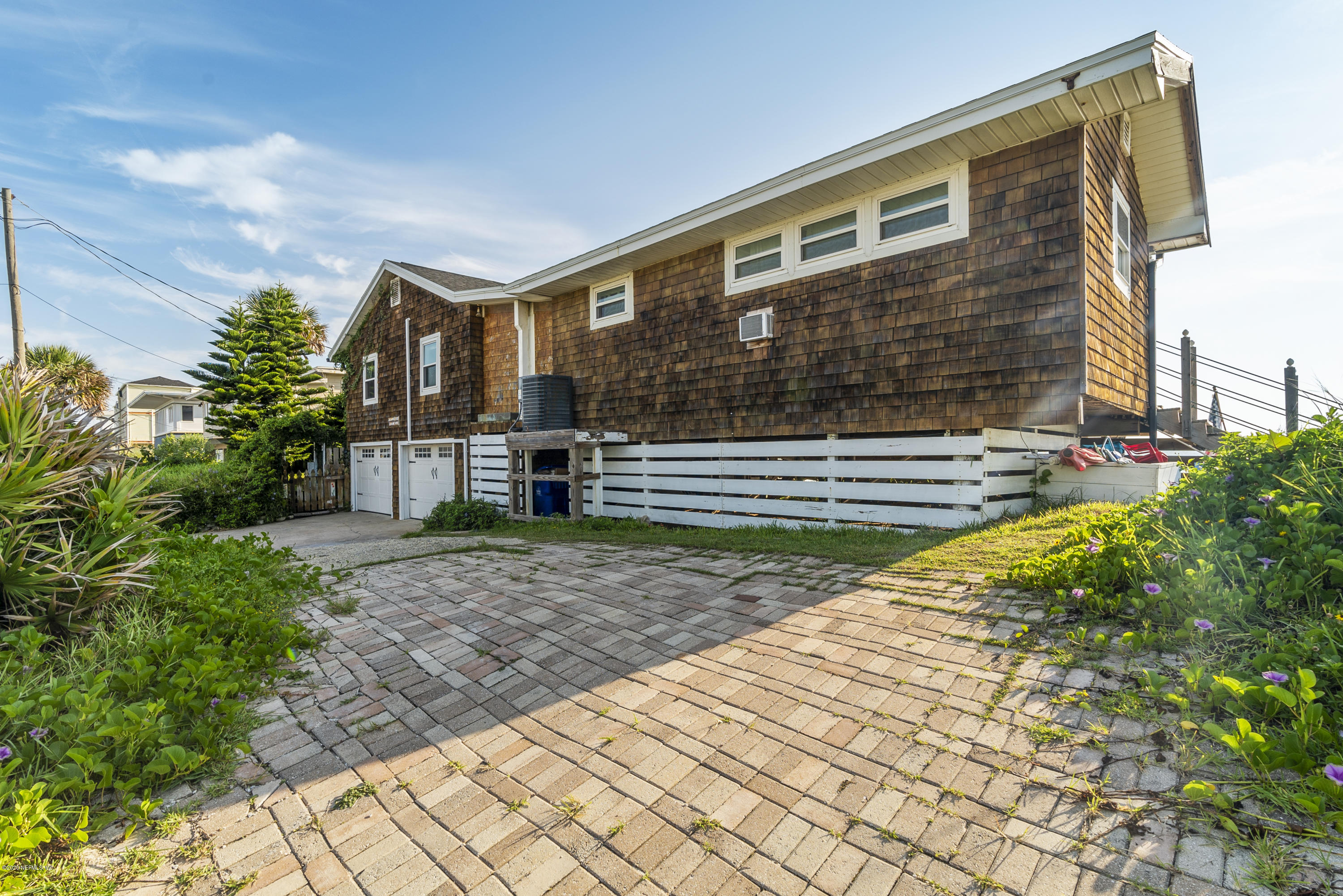 3490 Coastal Highway St. Augustine, FL 32084 - Photo 68 of 72 a front view of a house with a yard