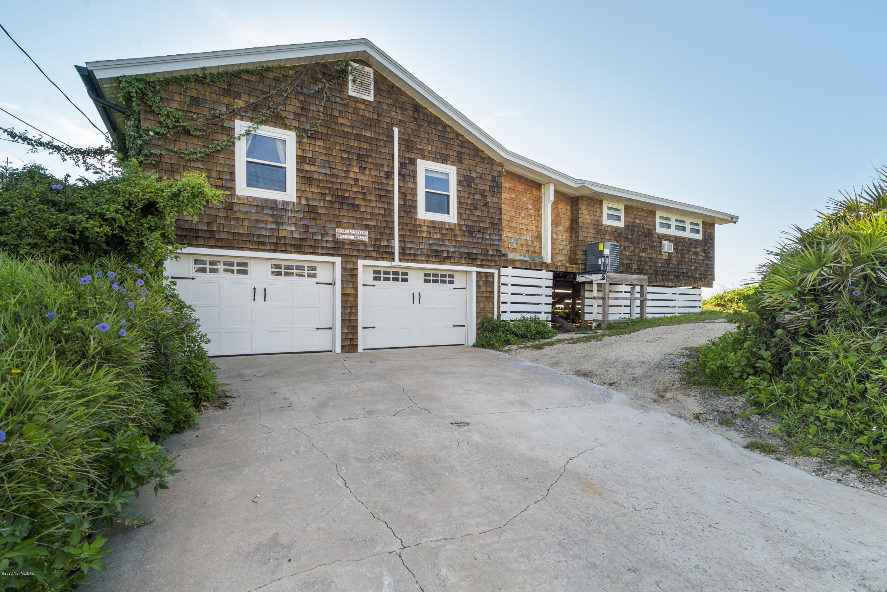 3490 Coastal Highway St. Augustine, FL 32084 - Photo 69 of 72 a front view of a house with a garage