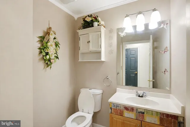 a view of a hallway with paintings on the wall