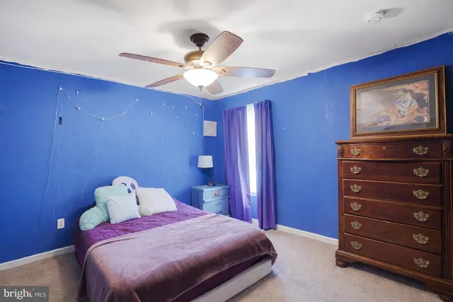 a view of a fence and trees