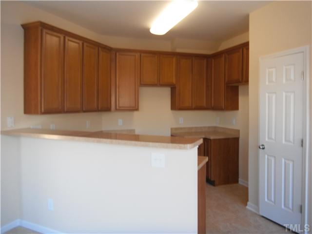 209 Deacon Ridge Street Wake Forest, NC 27587 - Photo 5 of 6 Represents a finished kitchen of the same floorpolan