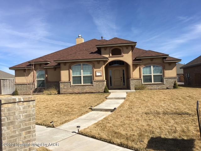 7303 Rochester Drive Amarillo, TX 79118 - Photo 1 of 20 a front view of a house with a yard