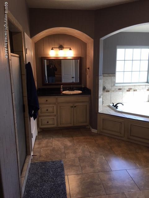 7303 Rochester Drive Amarillo, TX 79118 - Photo 12 of 20 a kitchen with stainless steel appliances a refrigerator and a sink