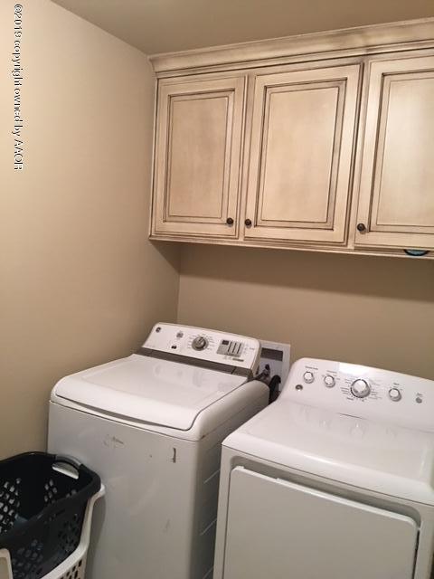 7303 Rochester Drive Amarillo, TX 79118 - Photo 19 of 20 a utility room with dryer and washer