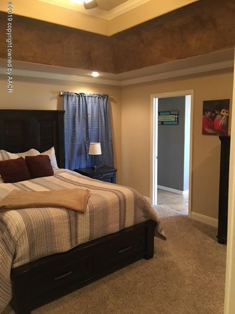 7303 Rochester Drive Amarillo, TX 79118 - Photo 10 of 20 a bedroom with a bed and a walk in closet