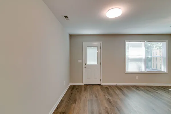a view of an empty room and window
