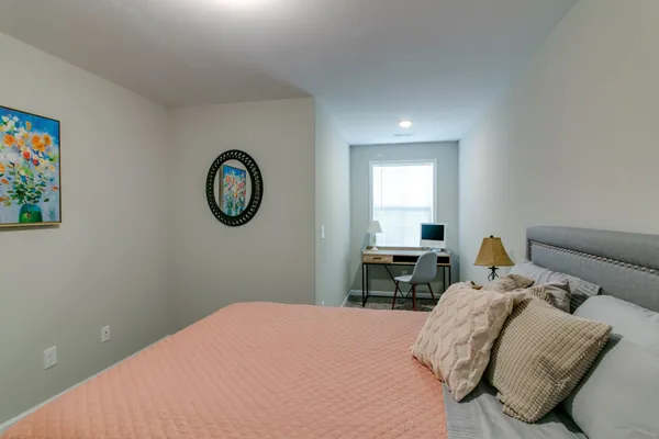a bathroom with a granite countertop sink a toilet and shower
