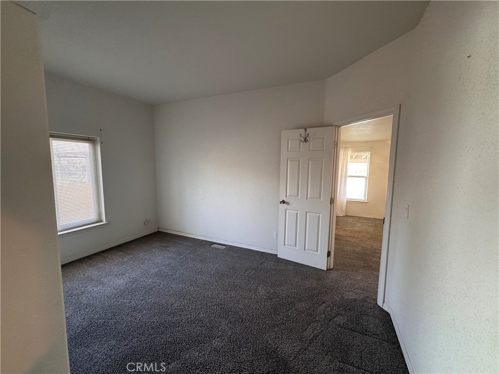 26362 Community Boulevard Barstow, CA 92311 - Photo 20 of 34 Bedroom 3 with access to the primary bedroom