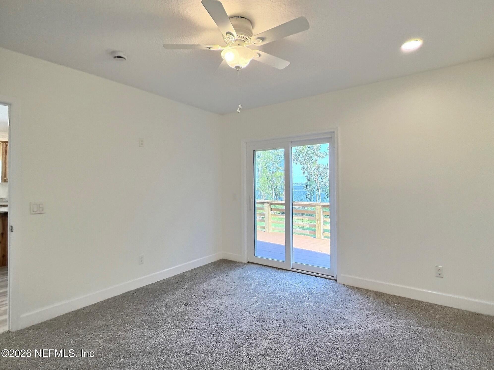 159 Mays Cove Road East Palatka, FL 32131 - Photo 52 of 62 an empty room with a window and a fan