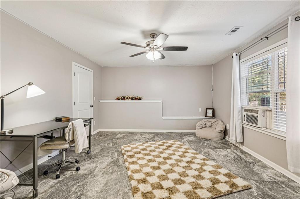909 Elderberry Lane Villa Rica, GA 30180 - Photo 25 of 34 a bedroom with a bed and a window