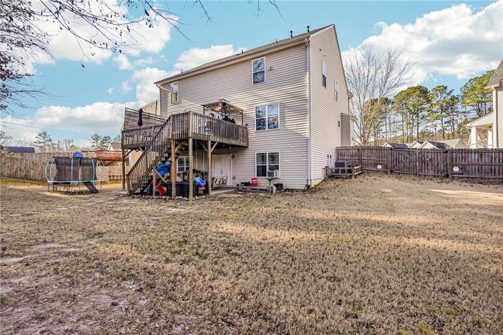 909 Elderberry Lane Villa Rica, GA 30180 - Photo 30 of 34 a view of a house with a yard