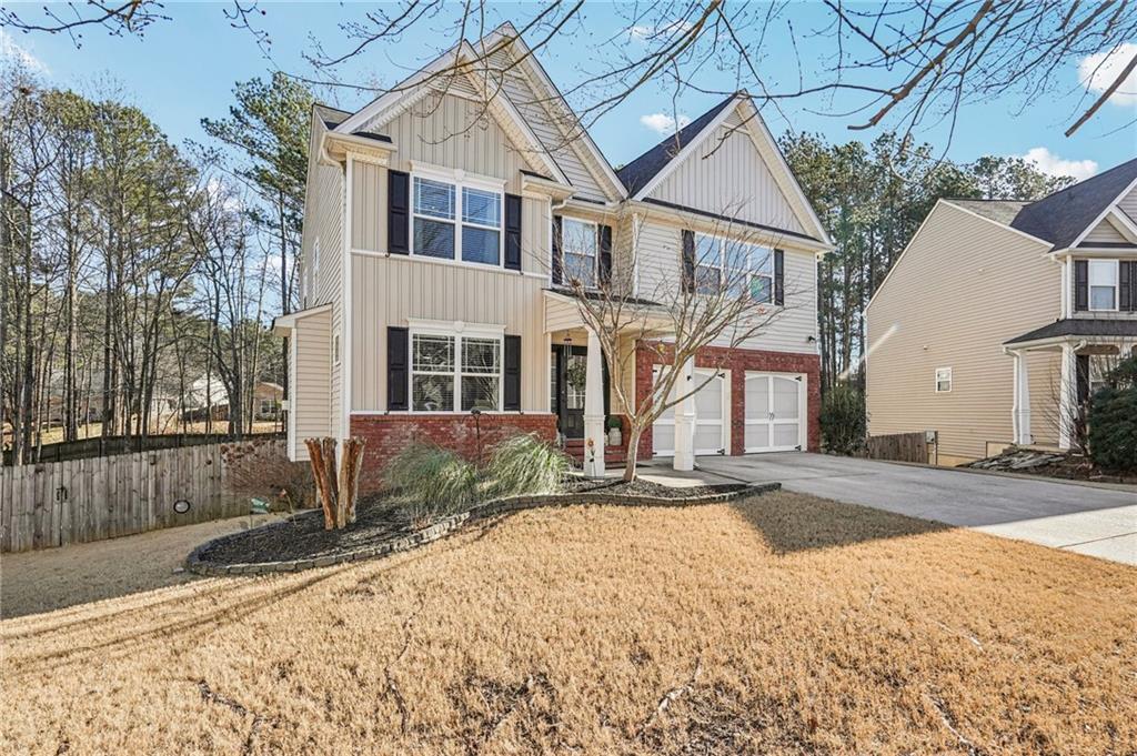 909 Elderberry Lane Villa Rica, GA 30180 - Photo 34 of 34 a front view of a house with a yard and garage