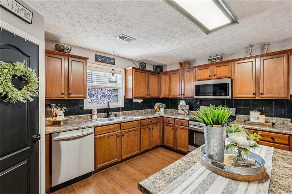 909 Elderberry Lane Villa Rica, GA 30180 - Photo 10 of 34 a kitchen with sink and cabinets