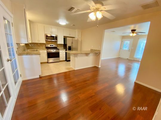 328 Mari Court Ridgecrest, CA 93555 - Photo 5 of 26 a view of a refrigerator in kitchen and a window