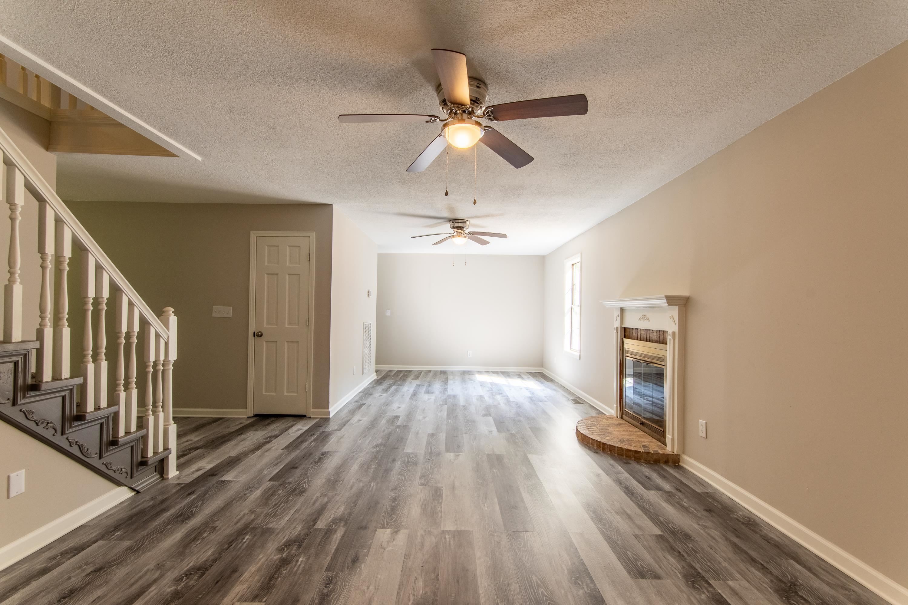 1020 County Road 600 Corinth, MS 38834 - Photo 15 of 37 wooden floor in an empty room with a window