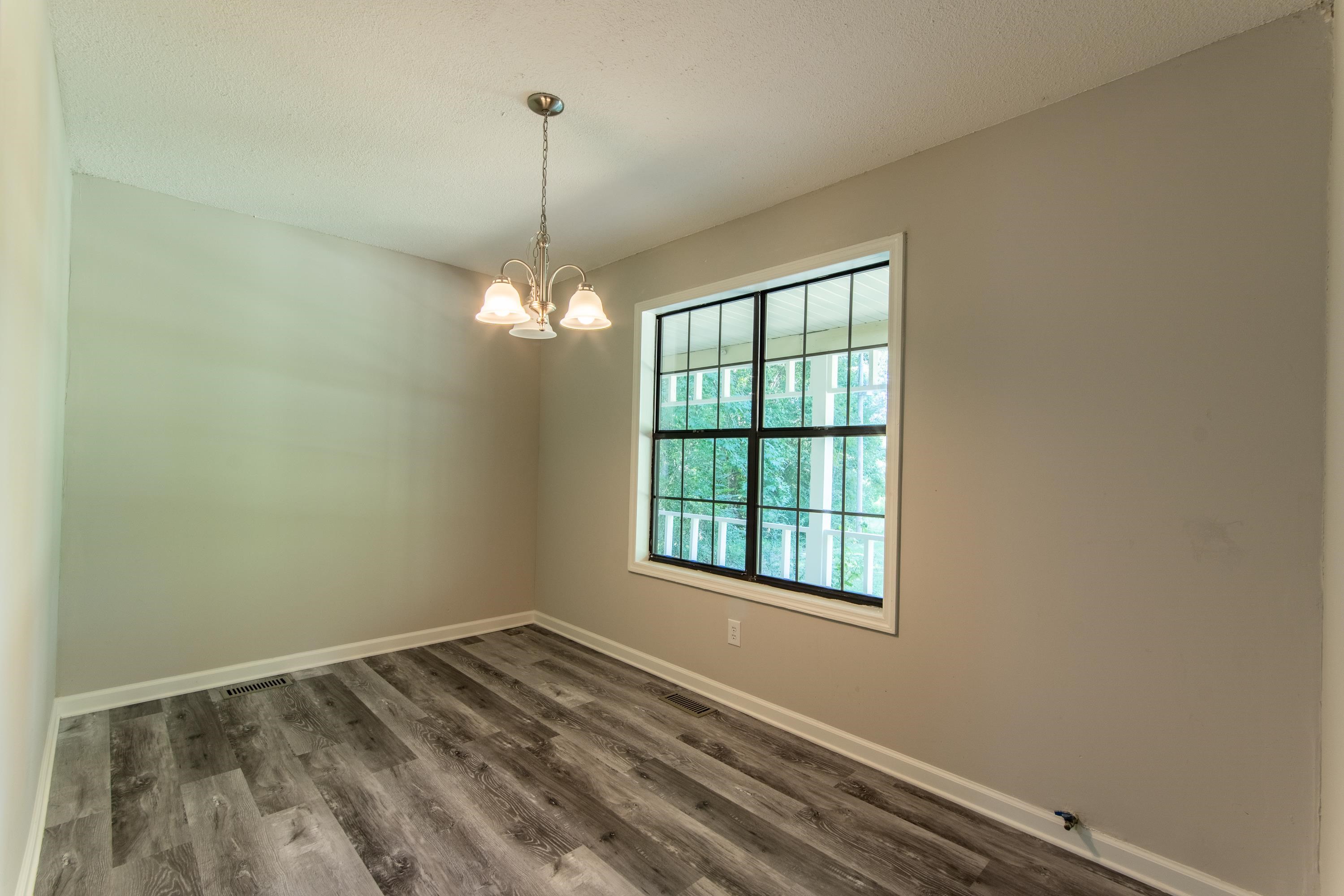1020 County Road 600 Corinth, MS 38834 - Photo 17 of 37 a view of a room with window and chandelier