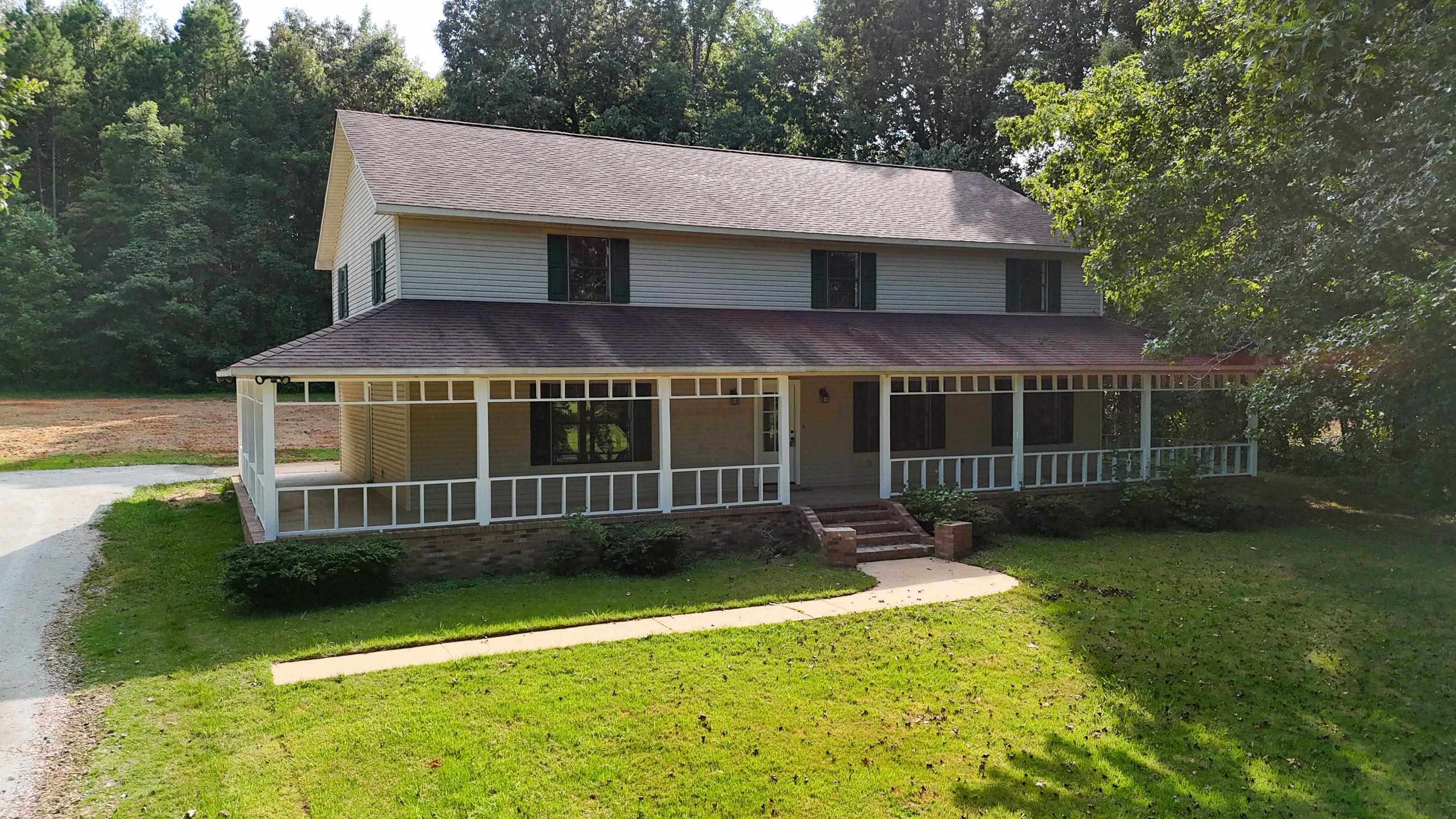 1020 County Road 600 Corinth, MS 38834 - Photo 2 of 37 a view of an house with backyard space and balcony