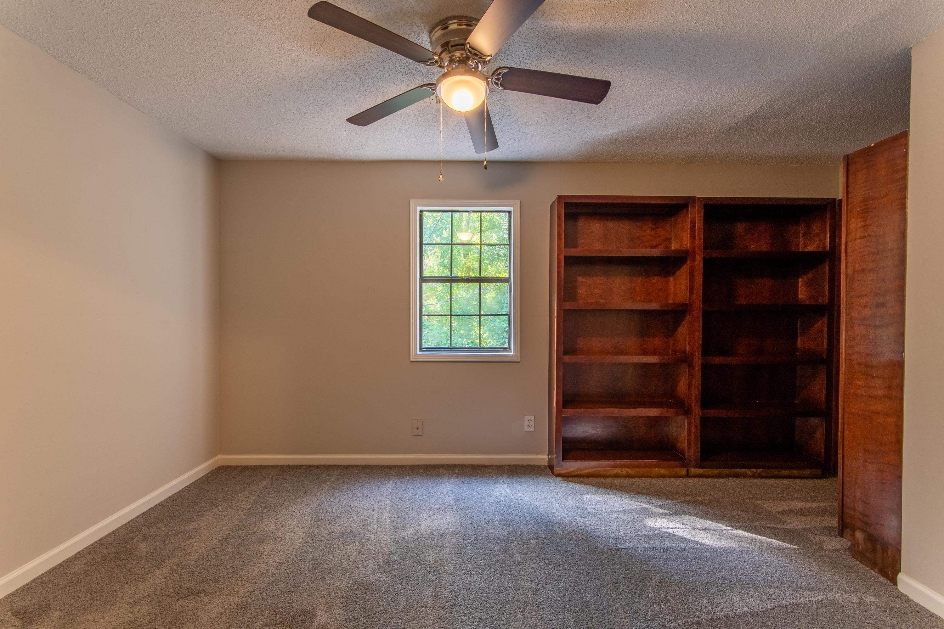 1020 County Road 600 Corinth, MS 38834 - Photo 30 of 37 an empty room with closet and fan
