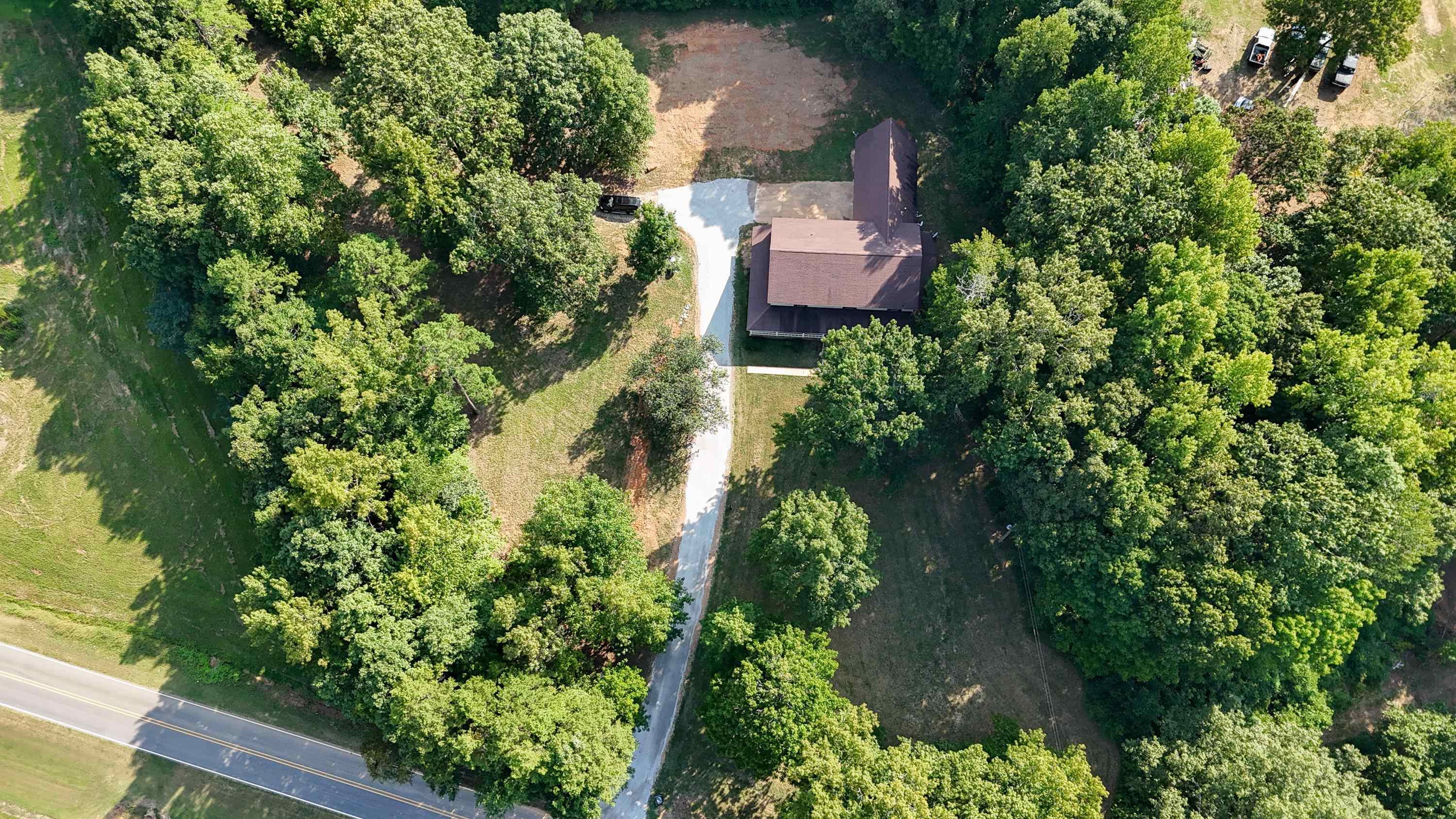 1020 County Road 600 Corinth, MS 38834 - Photo 37 of 37 an aerial view of a house with a yard