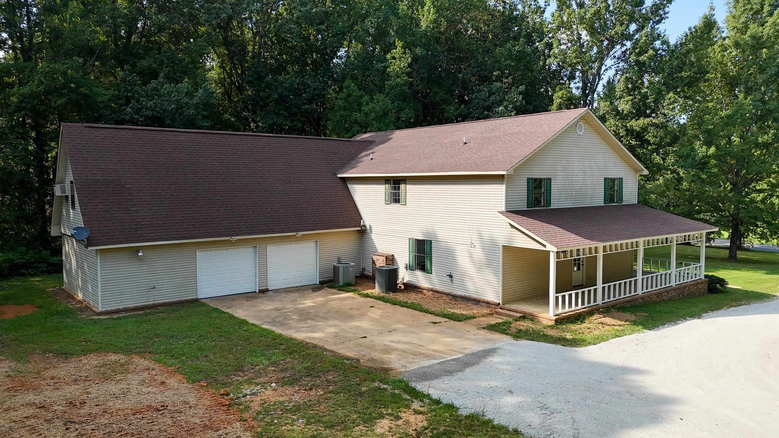 1020 County Road 600 Corinth, MS 38834 - Photo 5 of 37 a view of a house with a yard and large tree