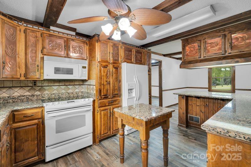 268 State Rd S-42-4322 Chesnee, SC 29323 - Photo 16 of 44 a kitchen with stainless steel appliances granite countertop a stove and a refrigerator
