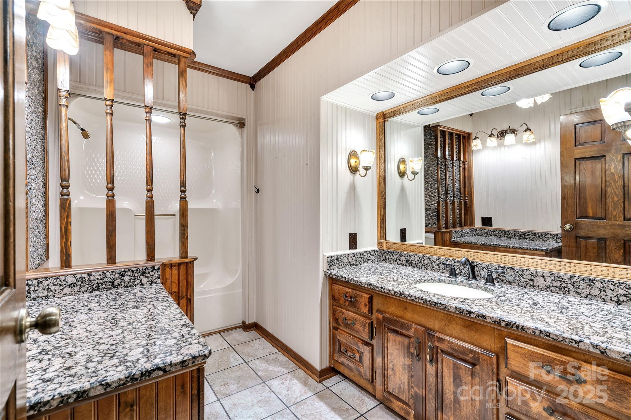 268 State Rd S-42-4322 Chesnee, SC 29323 - Photo 30 of 44 a bathroom with a granite countertop double vanity sink and a mirror