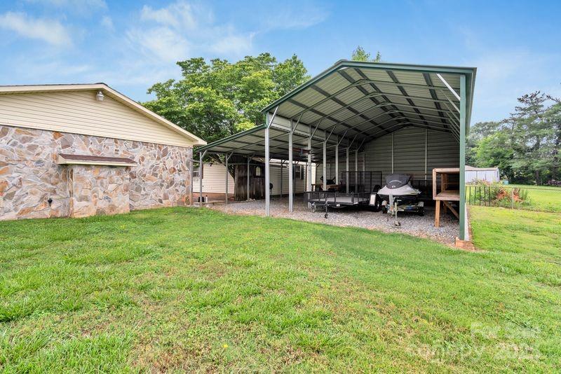 268 State Rd S-42-4322 Chesnee, SC 29323 - Photo 33 of 44 a view of a chair and table in backyard of the house