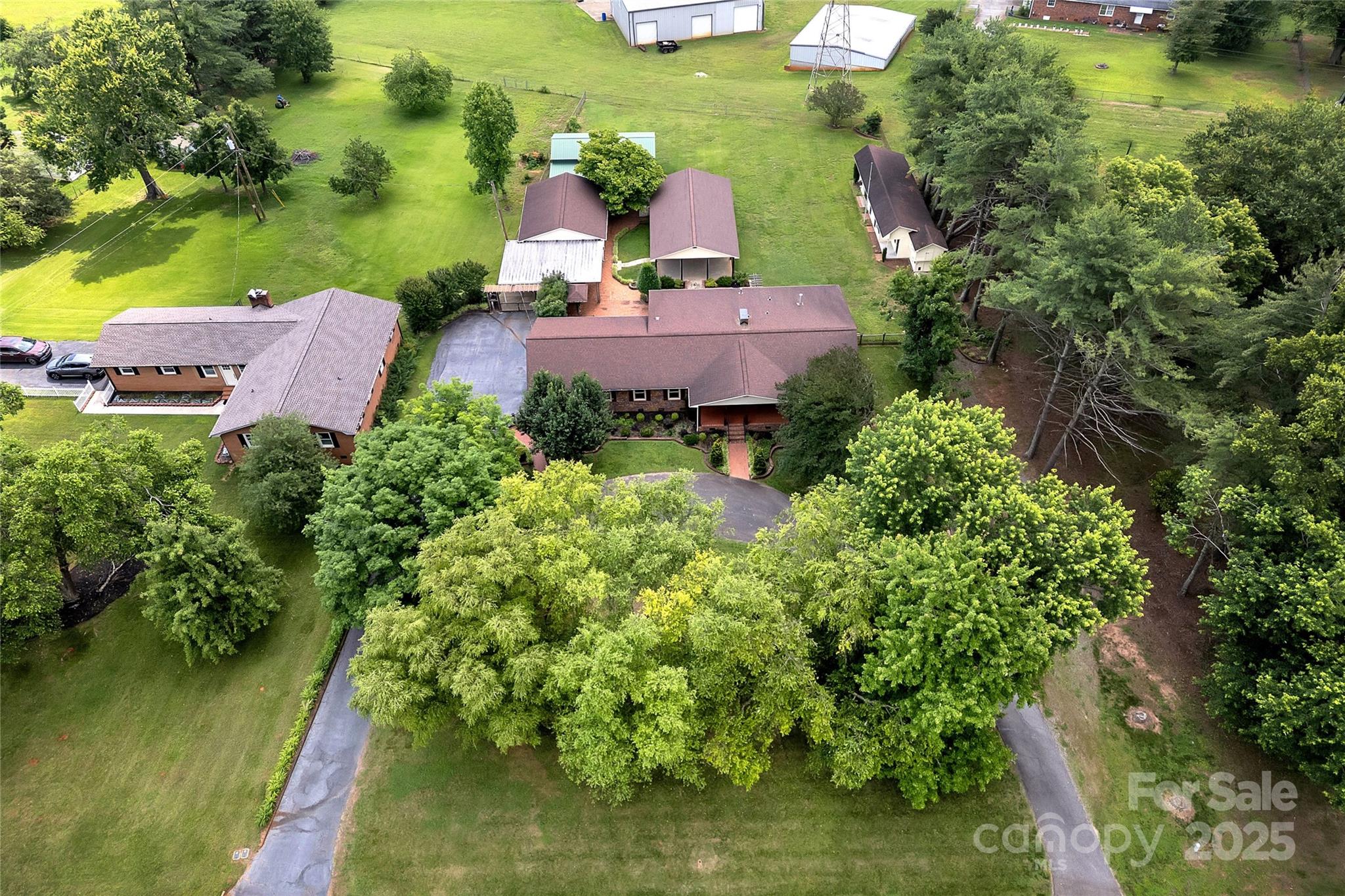 268 State Rd S-42-4322 Chesnee, SC 29323 - Photo 44 of 44 an aerial view of a house with a garden and lake view