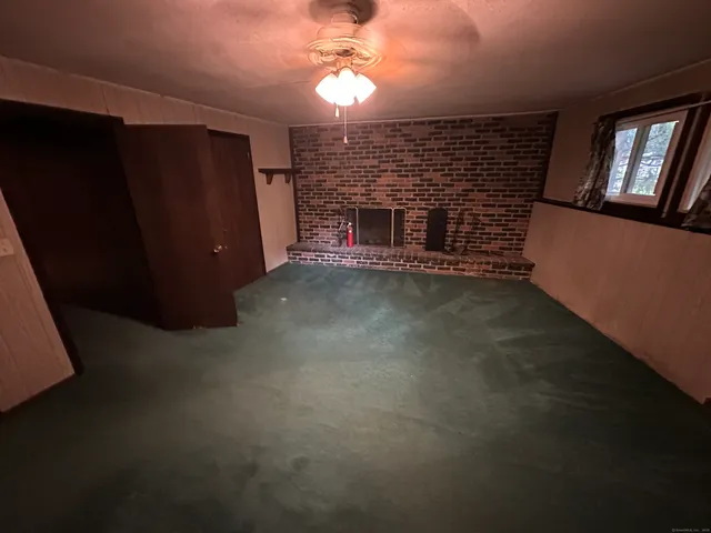 a view of a livingroom with furniture and furniture