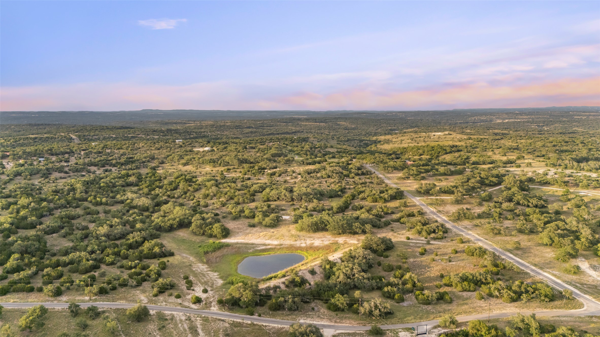 Lot 13 Byrd Ranch Road Johnson City, TX 78636 - Photo 16 of 19 Aerial view of property and surrounding area with a large body of water