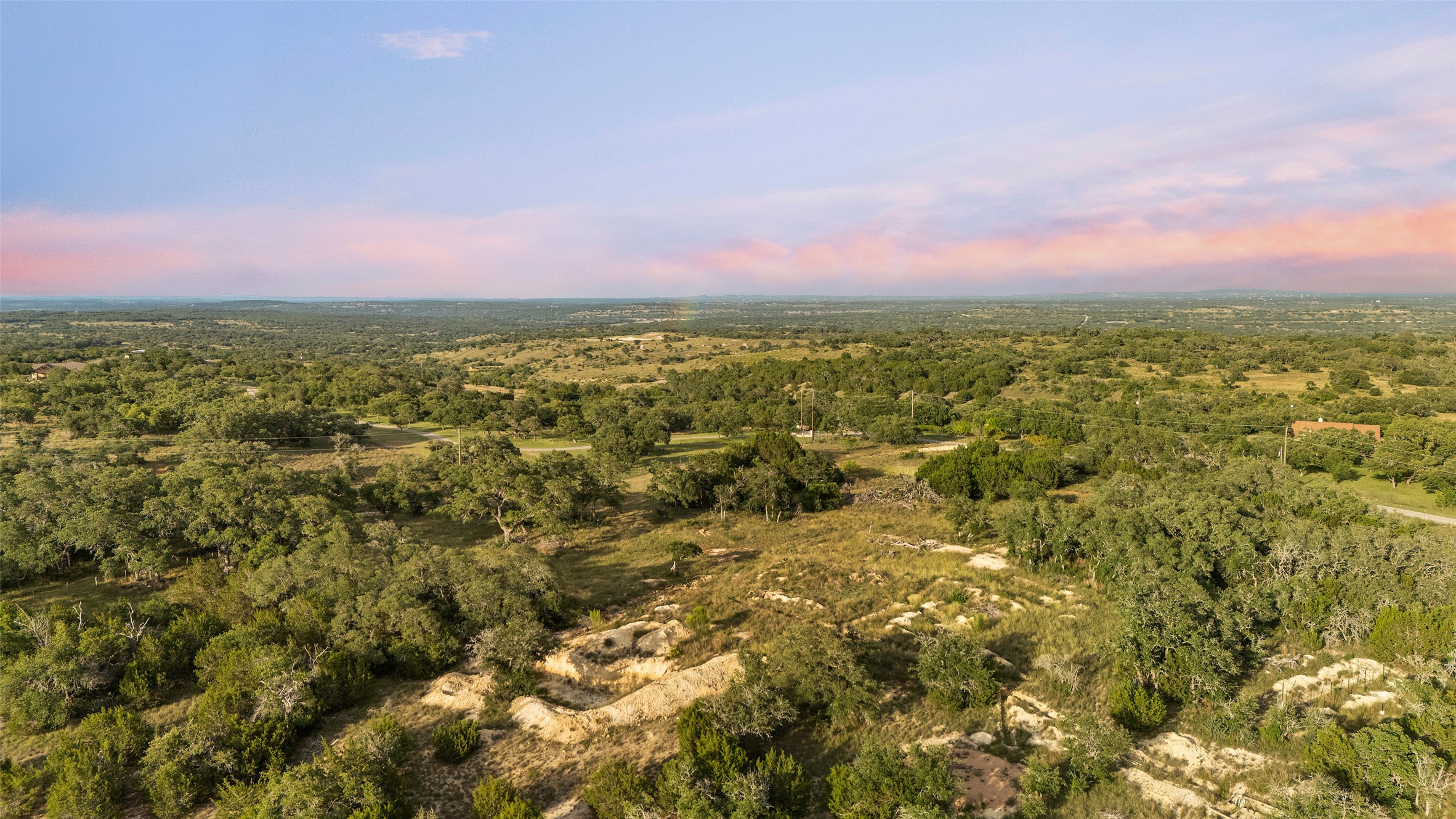 Lot 13 Byrd Ranch Road Johnson City, TX 78636 - Photo 2 of 19 Aerial view at dusk of a forest view