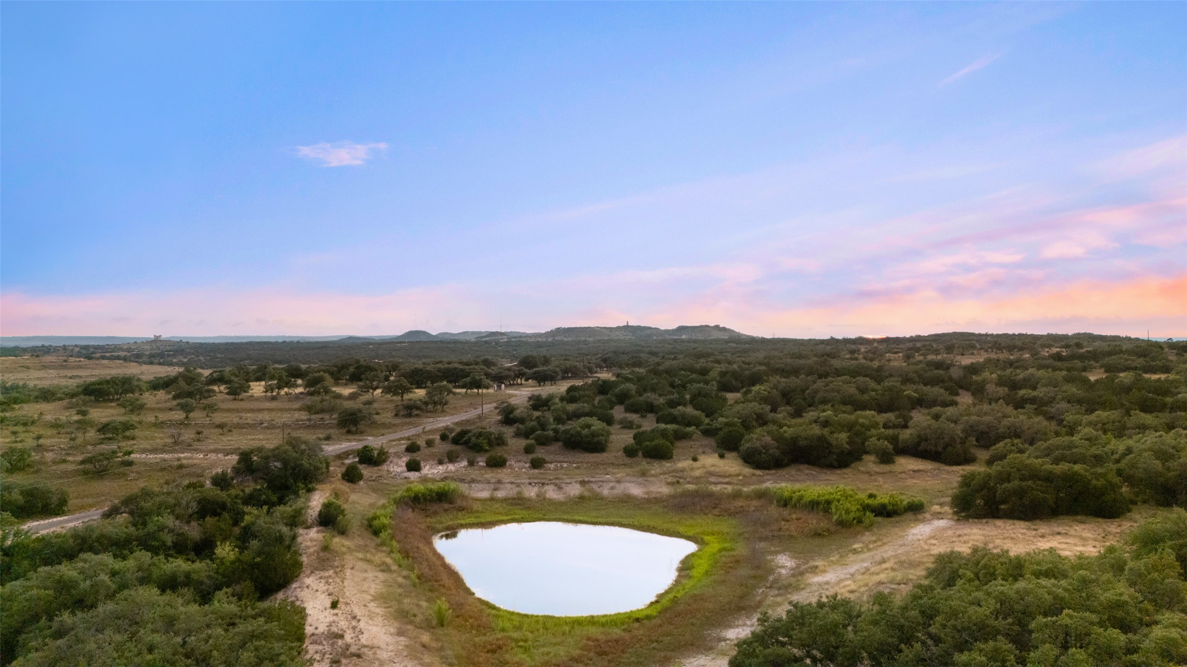 Lot 13 Byrd Ranch Road Johnson City, TX 78636 - Photo 5 of 19 Aerial view at dusk of a water view