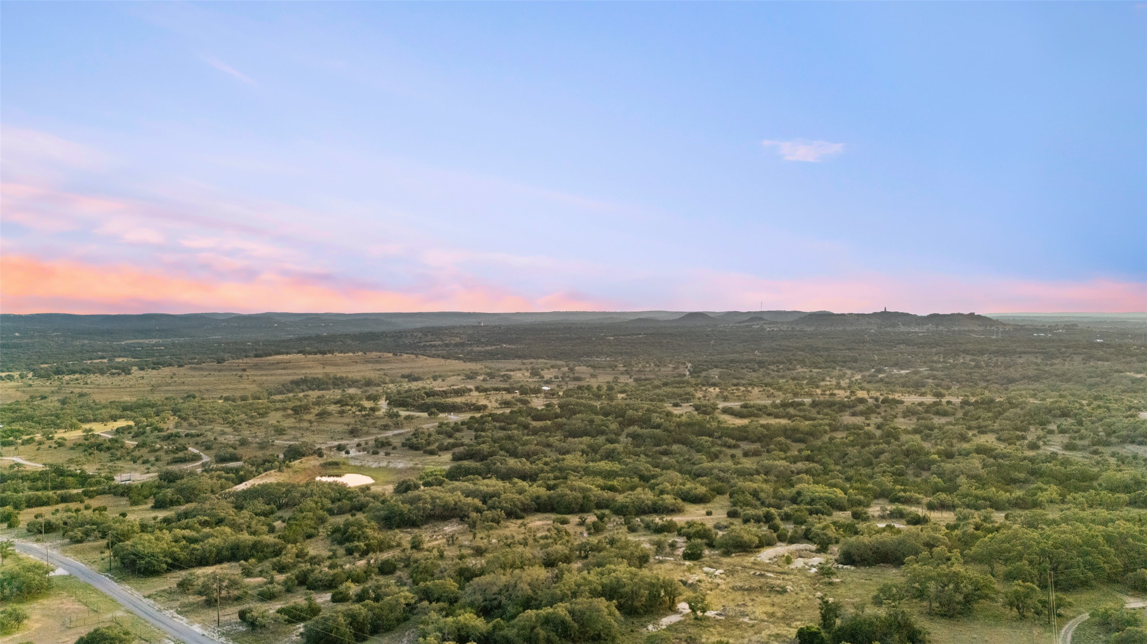 Lot 13 Byrd Ranch Road Johnson City, TX 78636 - Photo 9 of 19 Aerial view at dusk of a mountain view