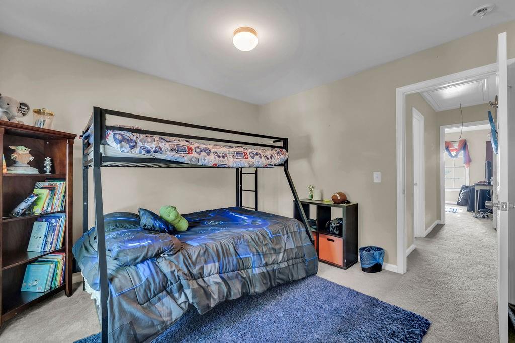 126 Meadow's Walk Drive Byron, GA 31008 - Photo 27 of 37 a bedroom with a bed and a table