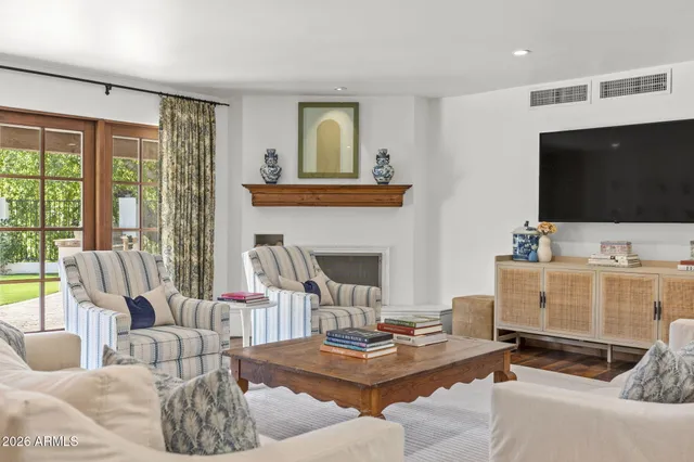 a dining room with furniture window and wooden floor