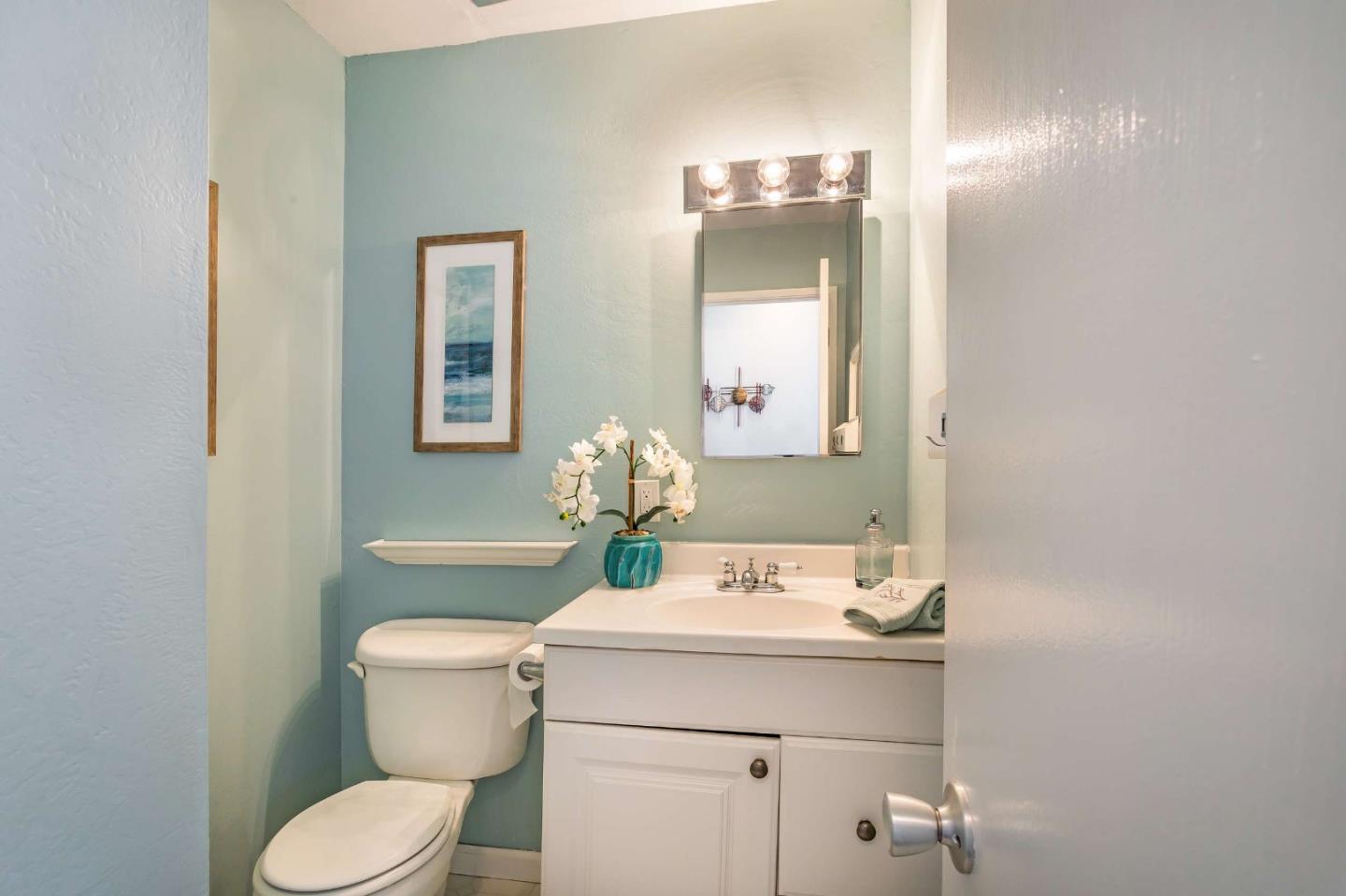 3 Yellowstone Way Pacifica, CA 94044 - Photo 11 of 21 a bathroom with a sink toilet and mirror