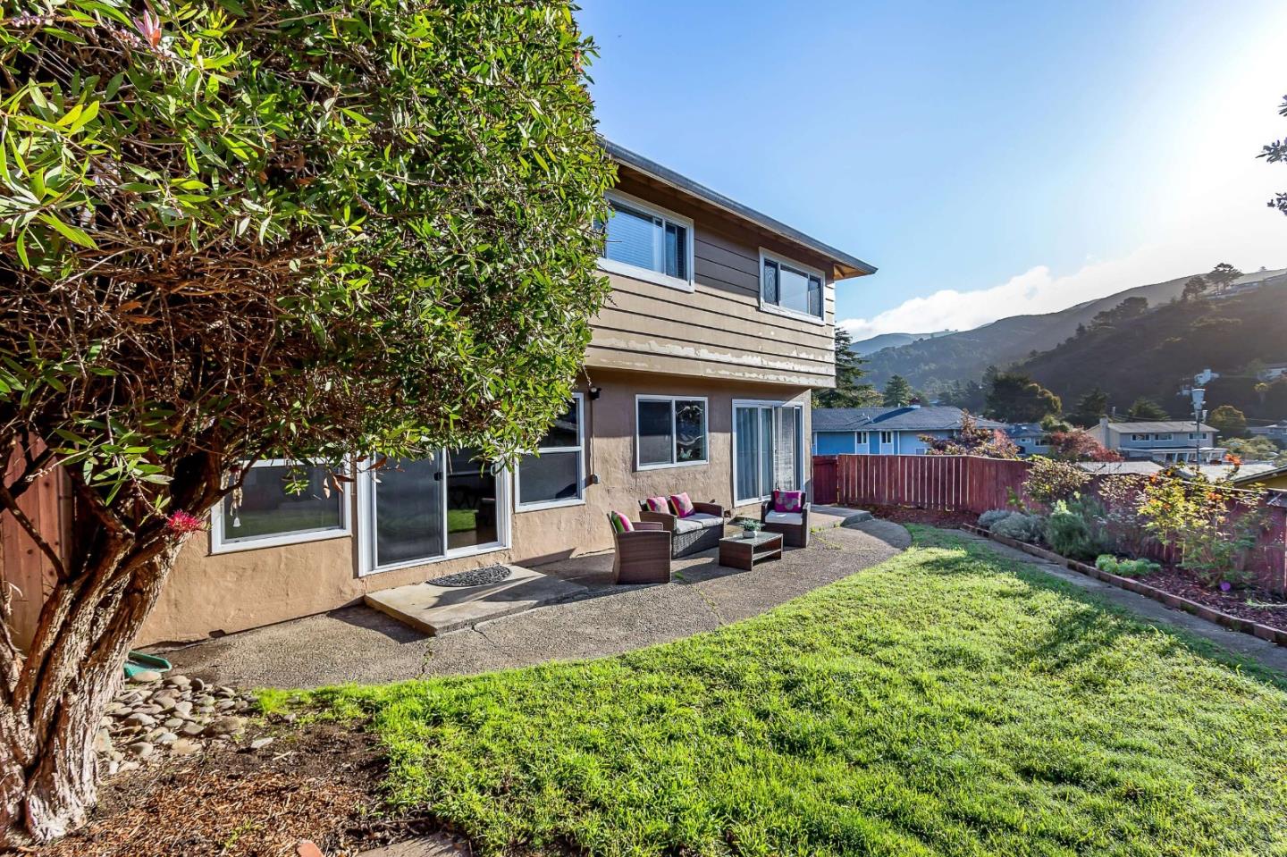 3 Yellowstone Way Pacifica, CA 94044 - Photo 19 of 21 a view of a house with sitting area and garden