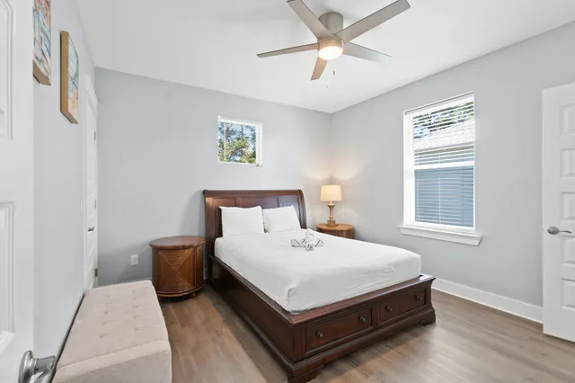 a bedroom with a bed and a chandelier