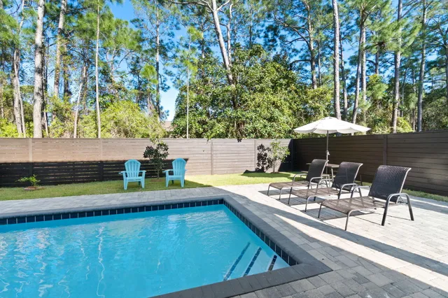 a view of a chairs and table in the patio