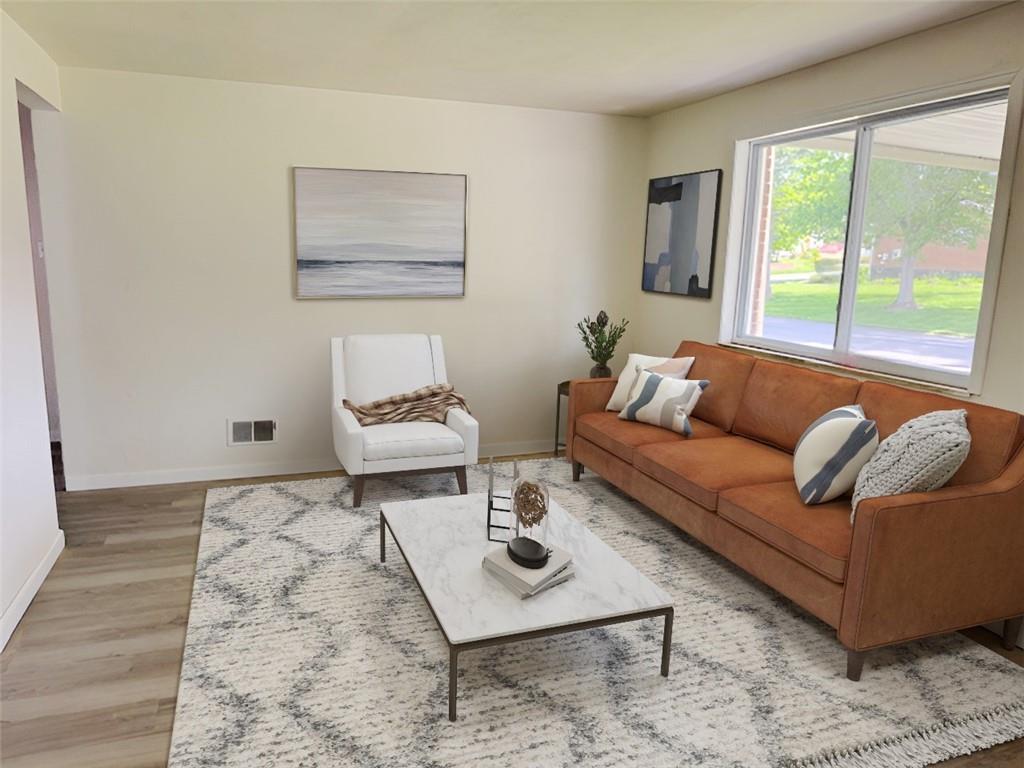 279 Olympic Road Pittsburgh, PA 15236 - Photo 3 of 25 a living room with furniture and a large window
