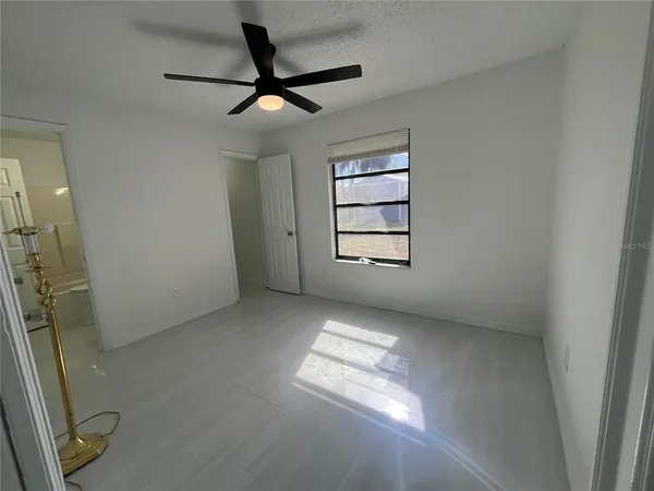 a view of empty room with windows