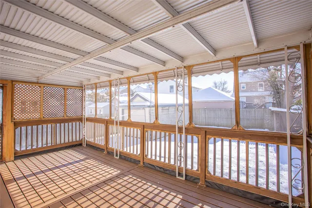 a view of a large room with wooden floor