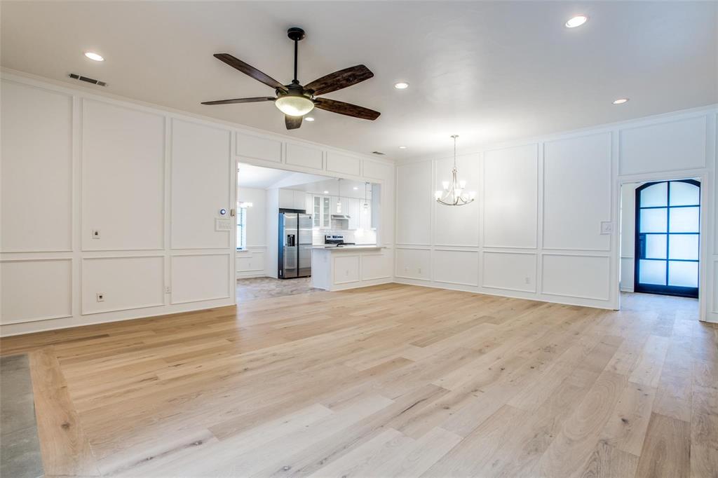6926 Northwood Road Dallas, TX 75225 - Photo 4 of 29 a view of empty room with wooden floor and windows