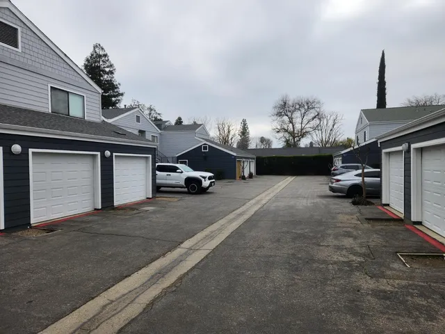 a view of a car park in front of house